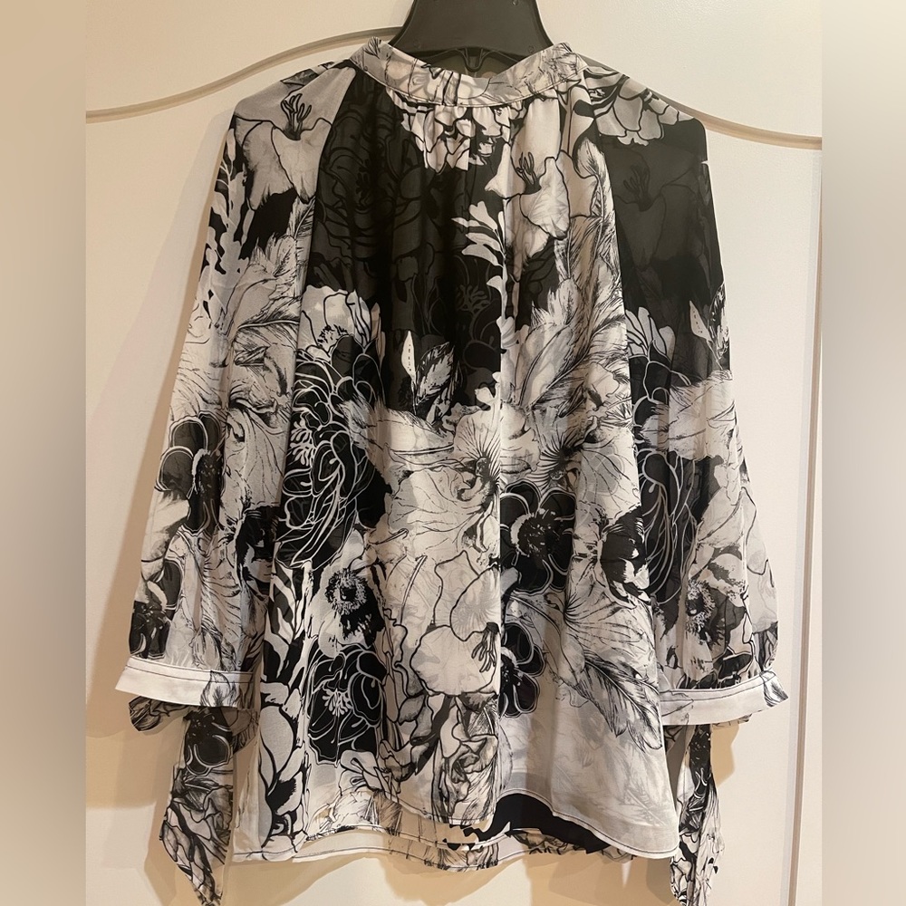 Woman’s blouse. Quarter sleeve. Never worn with tags. Black and white